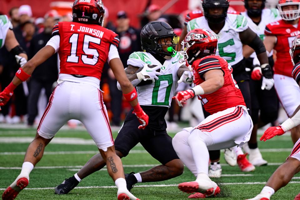 Oregon Ducks running back Bucky Irving (0) runs the ball against the Utah Utes during the first half at Rice-Eccles Stadium Oct. 28, 2023, in Salt Lake City.