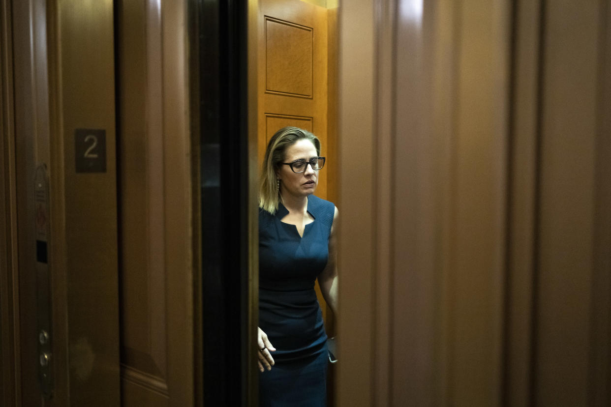 WASHINGTON, DC - APRIL 7: Sen. Kyrsten Sinema (D-AZ) gets into an elevator outside the Senate Chamber at the U.S. Capitol on April 7, 2022 in Washington, DC. The full Senate voted today to confirm the nomination of Supreme Court nominee Judge Ketanji Brown Jackson with a vote of 53-47. (Photo by Drew Angerer/Getty Images)