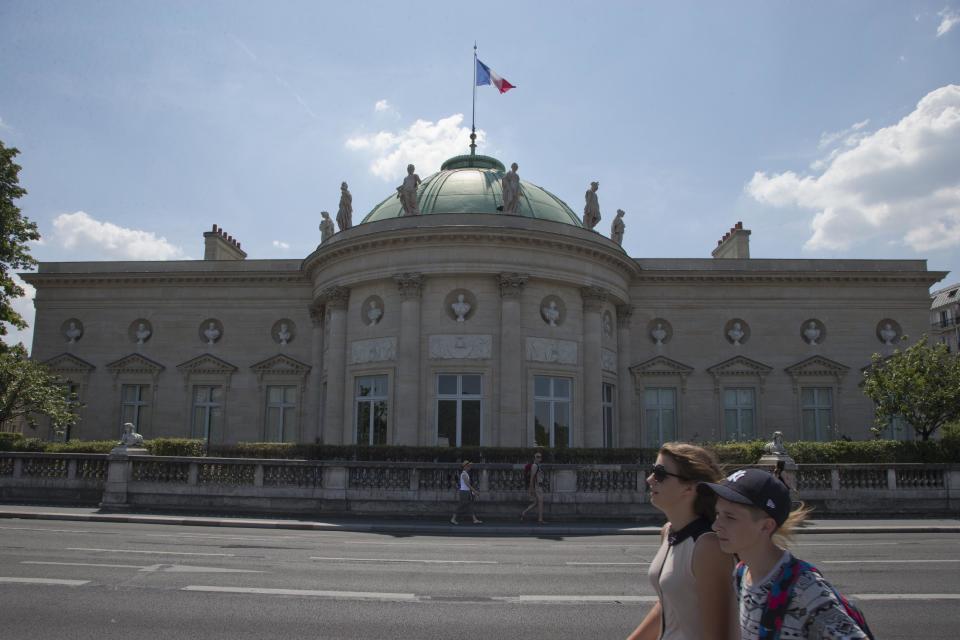 In this photo taken Friday, July 19, 2013, tourists walk in front of Legion of Honour building next to Musée d'Orsay in Paris, the inspiration for Thomas Jefferson's Monticello home located just outside Charlottesville, Va.(AP Photo/Francois Mori)