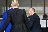 Plaintiff, British cave expert Vernon Unsworth, right, arrives at U.S. District Court Wednesday, Dec. 4, 2019, in Los Angeles. Tesla CEO Elon Musk is going on trial for his troublesome tweets in a case pitting the billionaire against the British diver he allegedly dubbed a pedophile. (AP Photo/Mark J. Terrill)