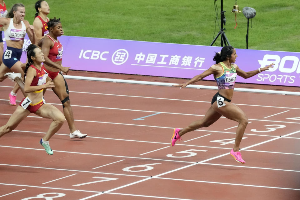 Singapore sprinter Shanti Pereira crosses the finish line to win the women's 200m final at the 2023 Hangzhou Asian Games