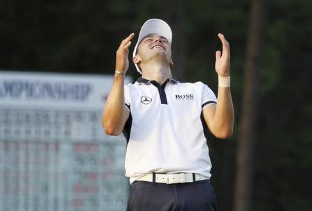 Martin Kaymer of Germany celebrates on the 18th green after winning the U.S. Open Championship golf tournament in Pinehurst, North Carolina, June 15, 2014. REUTERS/Robert Galbraith