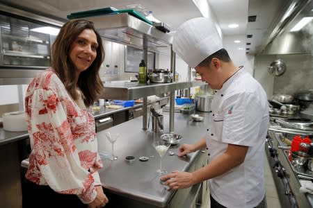 Delphyne Dabezies, head of Rova Caviar, and Chef Gang Yu pose at the Imperial Treasure Restaurant in Paris