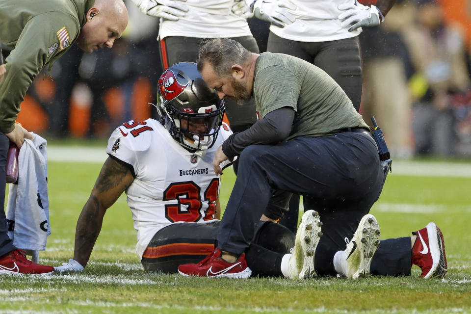 Tampa Bay Buccaneers safety Antoine Winfield Jr. is examined after being injured during overtime of an NFL football game against the Cleveland Browns in Cleveland, Sunday, Nov. 27, 2022. Cleveland won in overtime 23-17. (AP Photo/Ron Schwane)