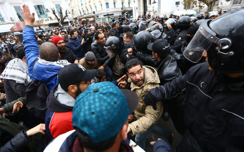 Police intervene during a protest in Tunis on January 12, 2018 - Credit: Anadolu