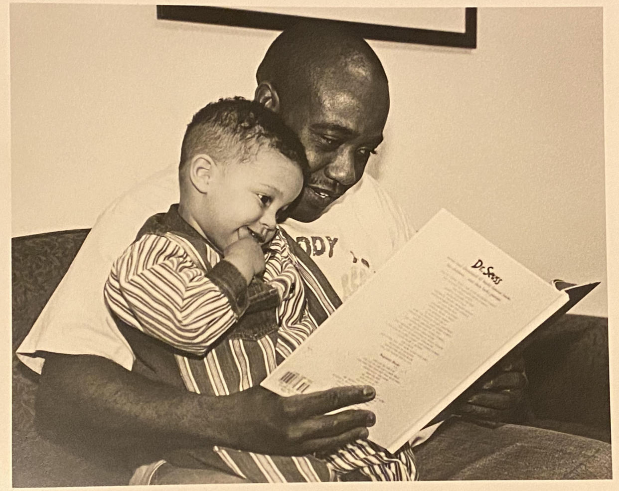 The author and his father at an early childhood family and education program in northeast Minneapolis in 1995. The photo was used for a time on the cover of the program's brochures. (Photo: Courtesy of Donny Pearson)