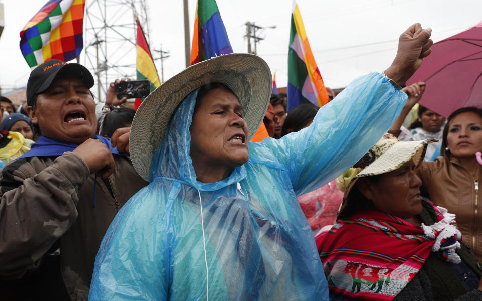 Coca leaf producers, supporters of former President Evo Morales, shout slogan, "Evo come back" during a march to Cochabamba, in Sacaba, Bolivia, Thursday, Nov. 14, 2019. Evo Morales, Bolivia’s first indigenous president, resigned on Sunday at military prompting, following massive nationwide protests over suspected vote-rigging in an Oct. 20 election in which he claimed to have won a fourth term in office. An Organization of American States audit of the vote found widespread irregularities. (AP Photo/Juan Karita)