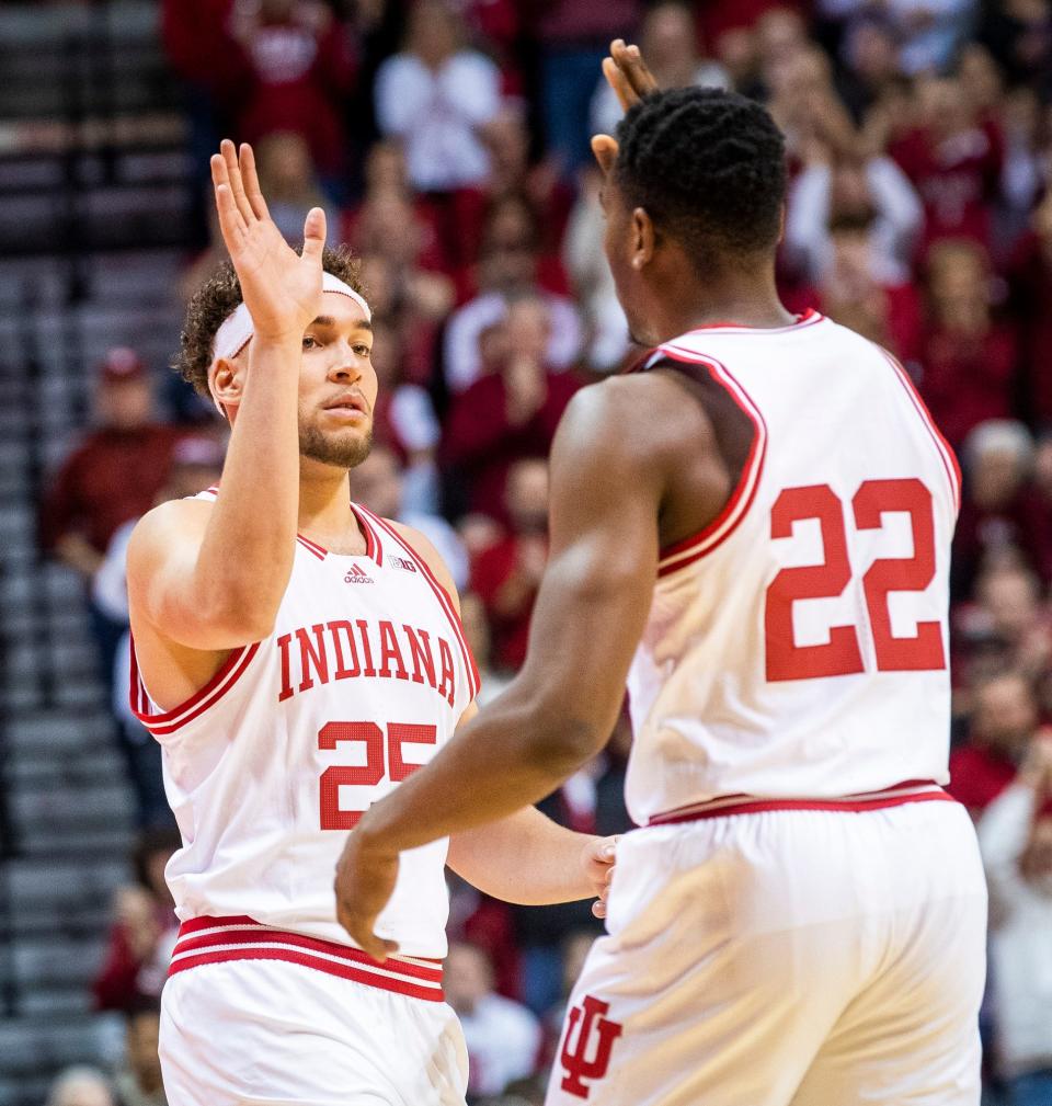 Indiana's Race Thompson (25) checks into the first game since his injury for Indiana's Jordan Geronimo (22) during the first half of the Indiana versus Michigan State men's basketball game at Simon Skjodt Assembly Hall on Sunday, Jan. 22, 2023.