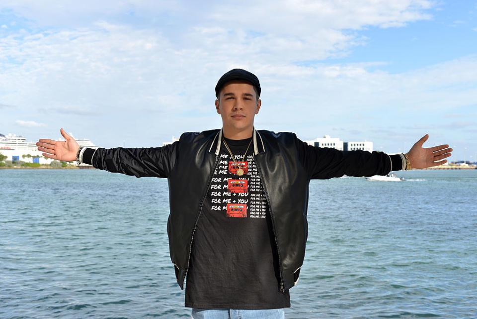 Austin Mahone standing by water