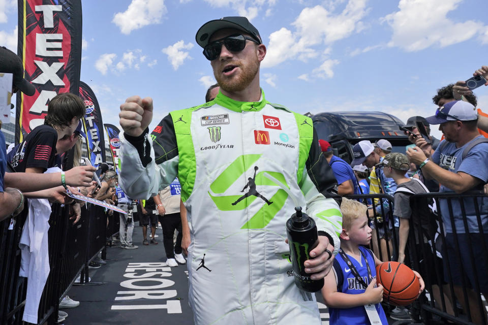 Tyler Reddick walks during introductions before aNASCAR Cup Series auto race at Texas Motor Speedway in Fort Worth, Texas, Sunday, Sept. 24, 2023. (AP Photo/LM Otero)