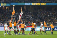 Australia's Darcy Swain left, reaches for the ball to win a lineout during the rugby international between England and the Wallabies in Perth, Australia, Saturday, July 2, 2022. (AP Photo/Gary Day)