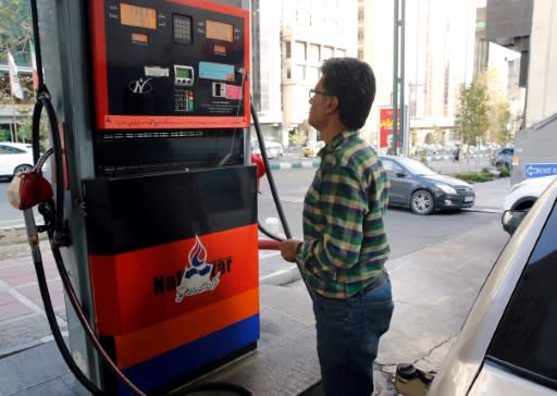 Iranians pump gas in Tehran in November 2019 amid a sudden hike in prices