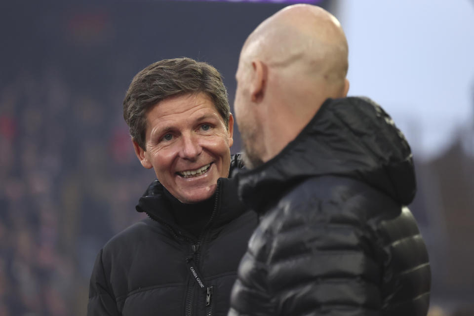 Manchester United's head coach Erik ten Hag, right, and Crystal Palace manager Oliver Glasner before the English Premier League soccer match between Crystal Palace and Manchester United at Selhurst Park stadium in London, England, Monday, May 6, 2024. (AP Photo/Ian Walton)