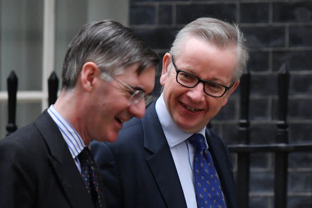 Jacob Rees-Mogg and Michael Gove share a joke in 2019. (Photo: DANIEL LEAL via Getty Images)