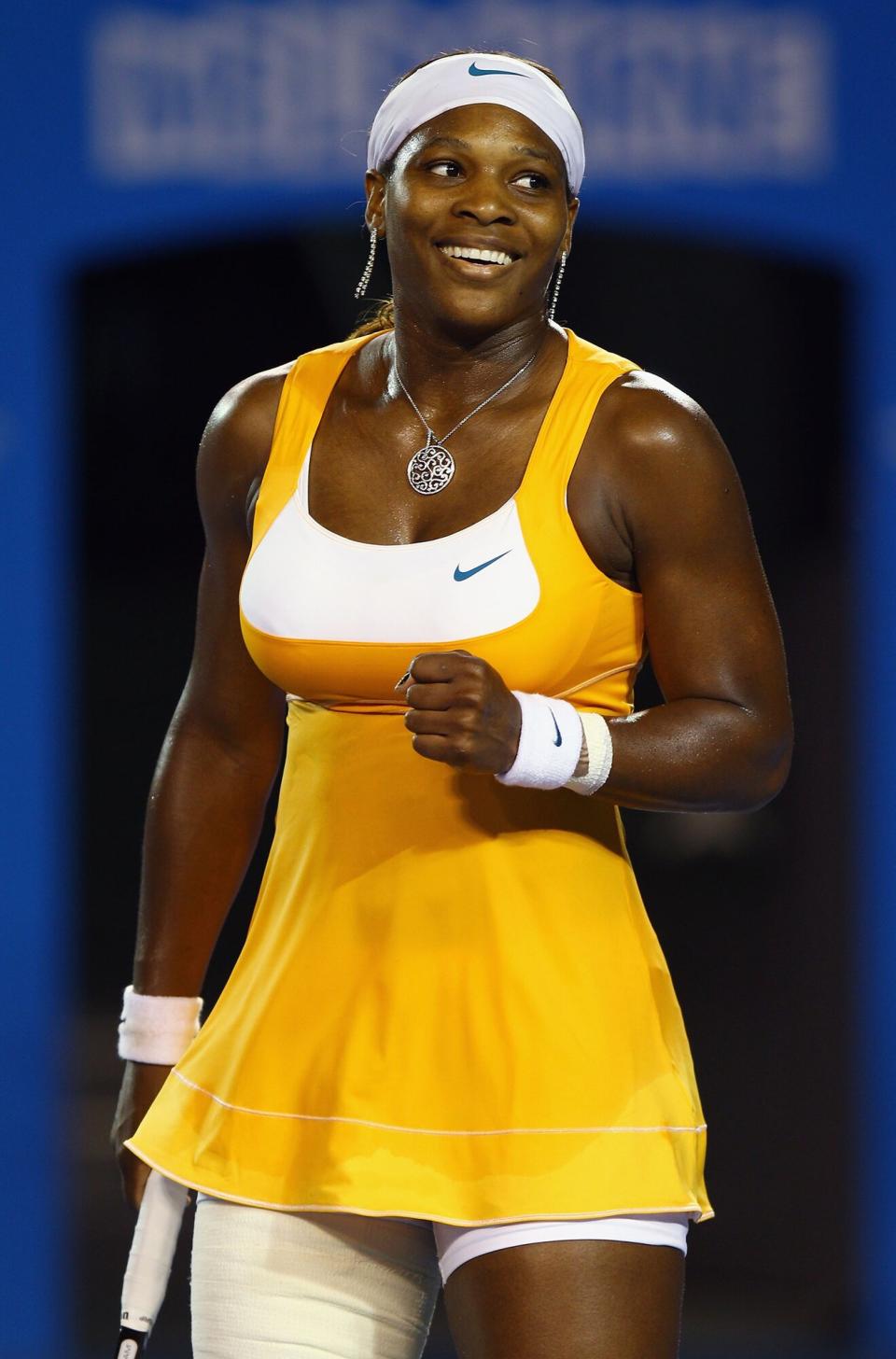 Serena Williams of the United States of America celebrates winning a point in her women's final match against Justine Henin of Belgium during day thirteen of the 2010 Australian Open at Melbourne Park on January 30, 2010 in Melbourne, Australia
