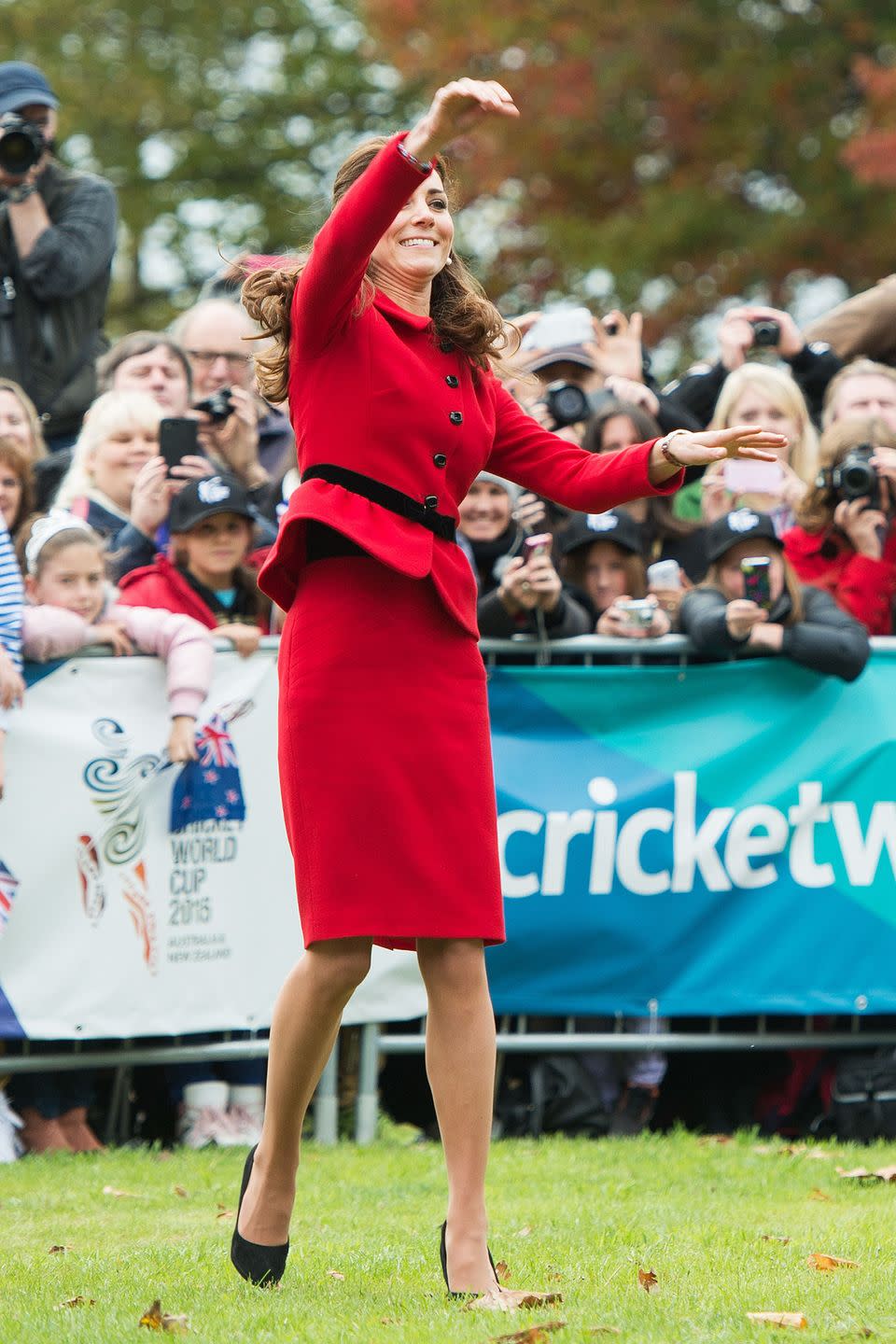 <p>No sneakers, no problem! Middleton throws a ball during a game of cricket in New Zealand.</p>