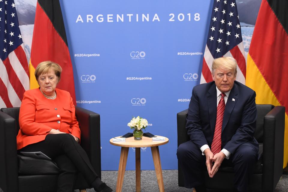 Germanys Chancellor Angela Merkel (L) and US President Donald Trump hold a bilateral meeting, on the sidelines of the G20 Leaders' Summit in Buenos Aires, on December 01, 2018. - The leaders of countries representing four-fifths of the global economy opened a two-day meeting in Argentina facing the deepest fractures since the first G20 summit convened 10 years ago in the throes of financial crisis. (Photo by SAUL LOEB / AFP)        (Photo credit should read SAUL LOEB/AFP/Getty Images)