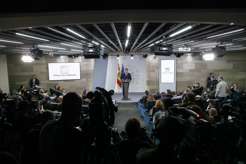 Watched by the media Spain's Prime Minister Pedro Sanchez delivers a statement at the Moncloa Palace in Madrid, Spain, Friday, Feb. 15, 2019. Sanchez has called early general elections for late April, the third such ballot in less than four years. (AP Photo/Andrea Comas)