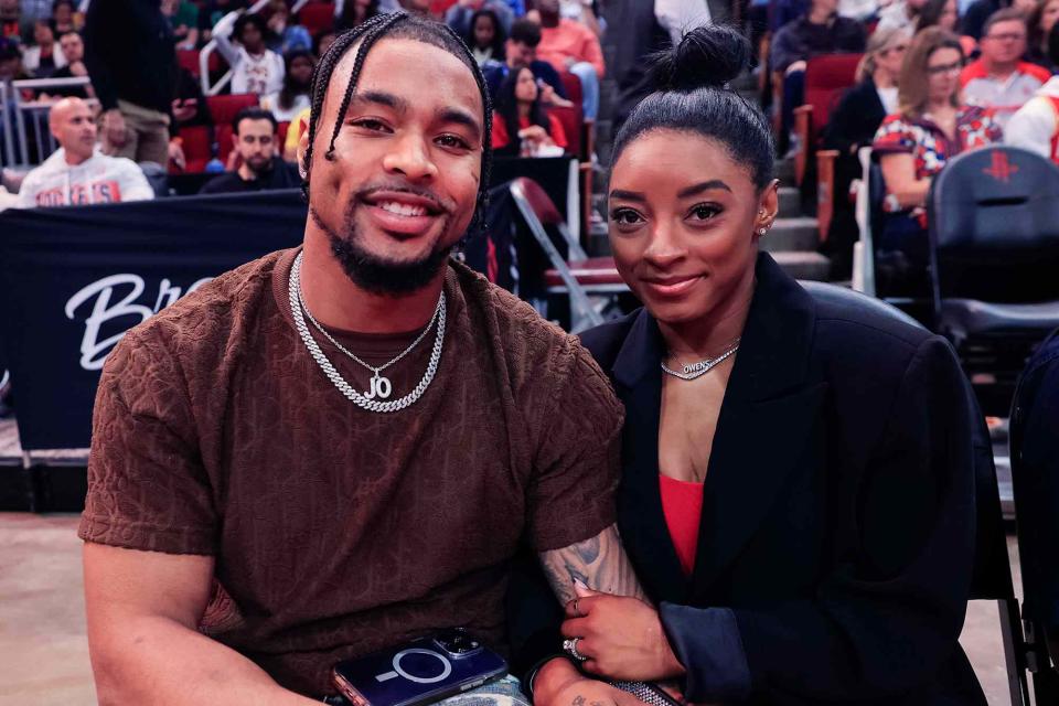 <p>Carmen Mandato/Getty</p> Simone Biles and Jonathan Owens attend a game between the Houston Rockets and the Los Angeles Lakers at Toyota Center on January 29, 2024 in Houston, Texas.