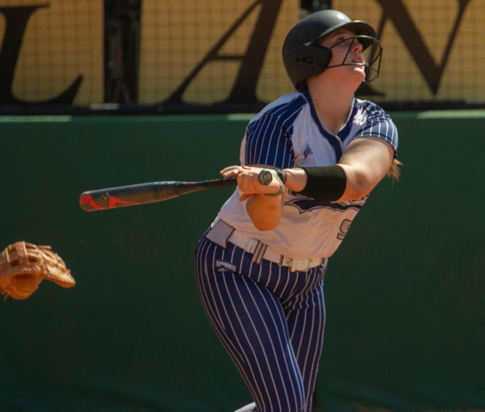 Spanish River High School’s Tamsin Scarrett (99) hits an RBI single to tie the game during the top of the sixth inning against Plant High School during their FHSAA State 7A Championship softball game at the Legends Way Ball Fields in Clermont Saturday. May 27, 2023.