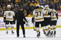 Boston Bruins defenseman Jakub Zboril (67) is helped off the ice during the second period of the team's NHL hockey game against the Nashville Predators on Thursday, Dec. 2, 2021, in Nashville, Tenn. (AP Photo/Mark Zaleski)