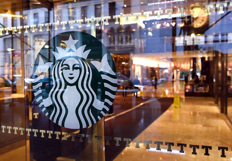 The Starbucks sign is seen at a store located in Trump Tower on 5th Avenue in New York November 10, 2015. Republican presidential candidate Donald Trump weighed in on Starbuck's red cup controversy, during a rally on November 9, with the prospect of boycotting Starbucks after the coffee company announced it had abandoned its Christmas-theme cups in favor of a simplistic red cup. AFP PHOTO / TIMOTHY A. CLARY (Photo credit should read TIMOTHY A. CLARY/AFP/Getty Images)
