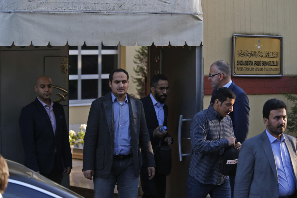 Staff exit the Saudi Arabia consulate in Istanbul, Monday, Oct. 8, 2018. Turkey has summoned the Saudi ambassador to request the kingdom's "full cooperation" in an investigation into the disappearance of journalist Jamal Khashoggi, who Turkish officials say was killed while visiting the Saudi Consulate in Istanbul. The 59-year-old Khashoggi went missing last Tuesday while visiting the consulate for paperwork to marry his Turkish fiancee. (AP Photo/Lefteris Pitarakis)