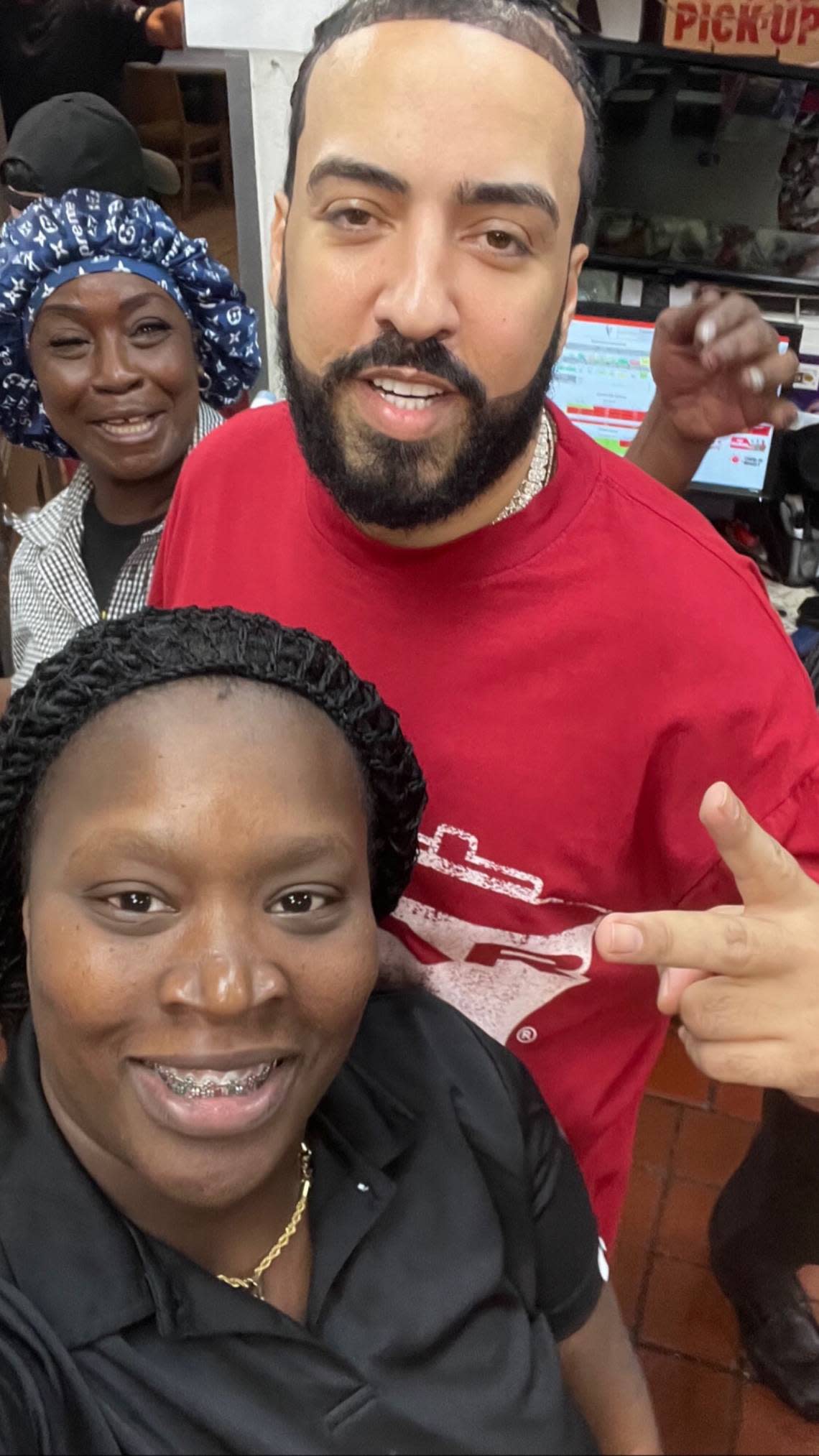 Rapper French Montana poses for picture at a Kentucky Fried Chicken restaurant after a video shoot he was involved in, in Miami Gardens, erupted in gunfire last week.