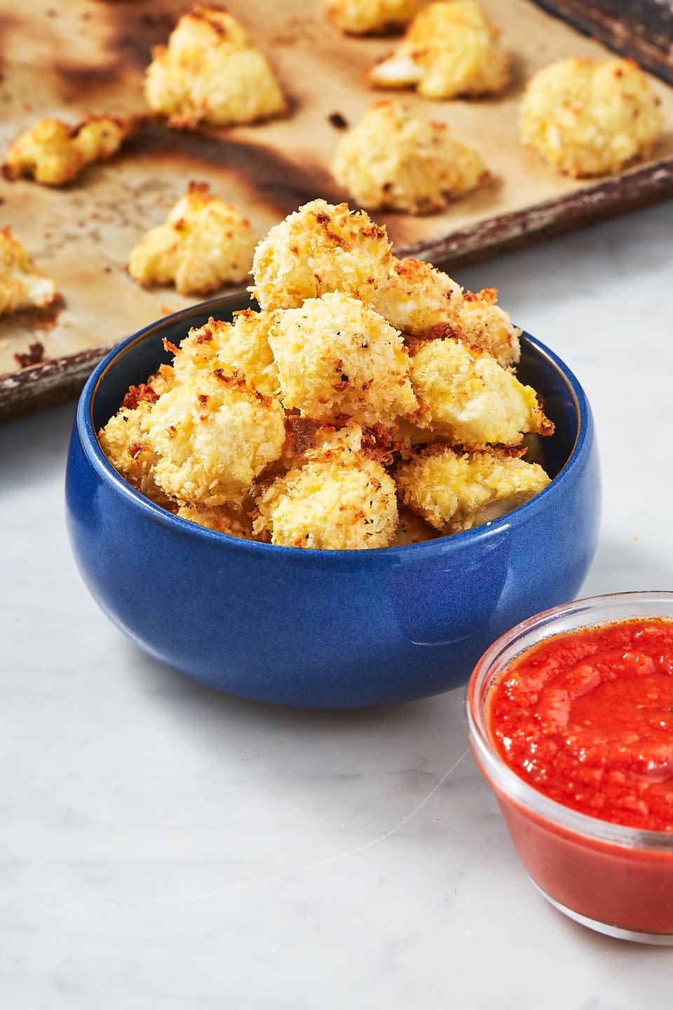 <p>Cauliflower is a miracle veggie that has really changed the way we snack—these Parmesan bites are incredible! Try them dipped in <a href="https://www.delish.com/cooking/recipe-ideas/a24570093/marinara-sauce-recipe/" rel="nofollow noopener" target="_blank" data-ylk="slk:marinara sauce;elm:context_link;itc:0;sec:content-canvas" class="link ">marinara sauce</a>, or even <a href="https://www.delish.com/cooking/recipe-ideas/a25634518/ranch-dressing-recipe/" rel="nofollow noopener" target="_blank" data-ylk="slk:ranch dressing;elm:context_link;itc:0;sec:content-canvas" class="link ">ranch dressing</a>, if that's what you're into.</p><p>Get the <strong><a href="https://www.delish.com/cooking/recipe-ideas/recipes/a50341/parmesan-cauliflower-bites-recipe/" rel="nofollow noopener" target="_blank" data-ylk="slk:Parmesan Cauliflower Bites recipe;elm:context_link;itc:0;sec:content-canvas" class="link ">Parmesan Cauliflower Bites recipe</a></strong>.</p>