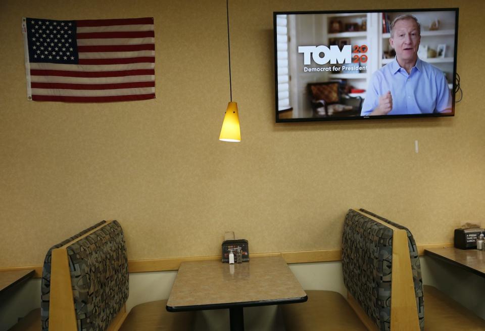 An advertisement for Tom Steyer’s presidential campaign plays in a grocery store in Waverly, Iowa, in January 2020. <a href="https://media.gettyimages.com/photos/an-advertisement-for-tom-steyers-presidential-campaign-plays-inside-picture-id1196692334?s=612x612" rel="nofollow noopener" target="_blank" data-ylk="slk:Jessica Rinaldi/The Boston Globe via Getty Images;elm:context_link;itc:0;sec:content-canvas" class="link ">Jessica Rinaldi/The Boston Globe via Getty Images</a>