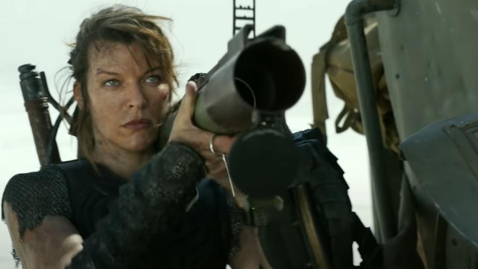 Milla Jovovich in Monster Hunter holding a large rocket gun on her shoulder