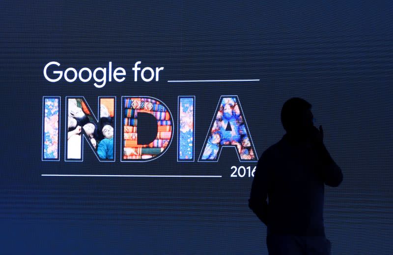 Man stands in front of a screen during a Google event in New Delhi