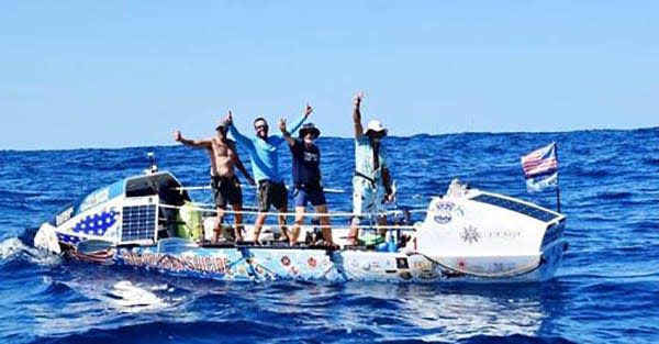 During the Talisker Whisky Atlantic Challenge, a 3,000-mile charity race that began Dec. 12, Fernandina Beach-based rowing team Foar from Home waves to a passing support boat.