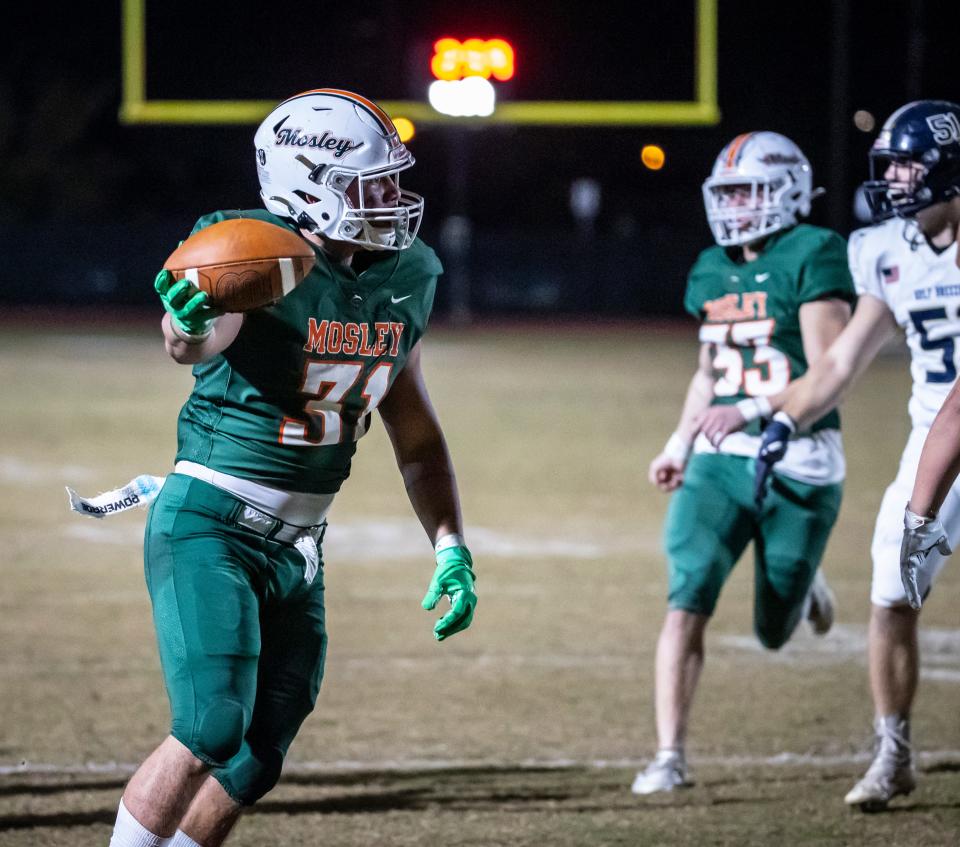 Mosley defender Jordan Whitely celebrates coming up with a Gulf Breeze fumble. Mosley hosted Gulf Breeze in Regional quarterfinal action at Tommy Oliver Stadium Friday, November 12, 2021.
