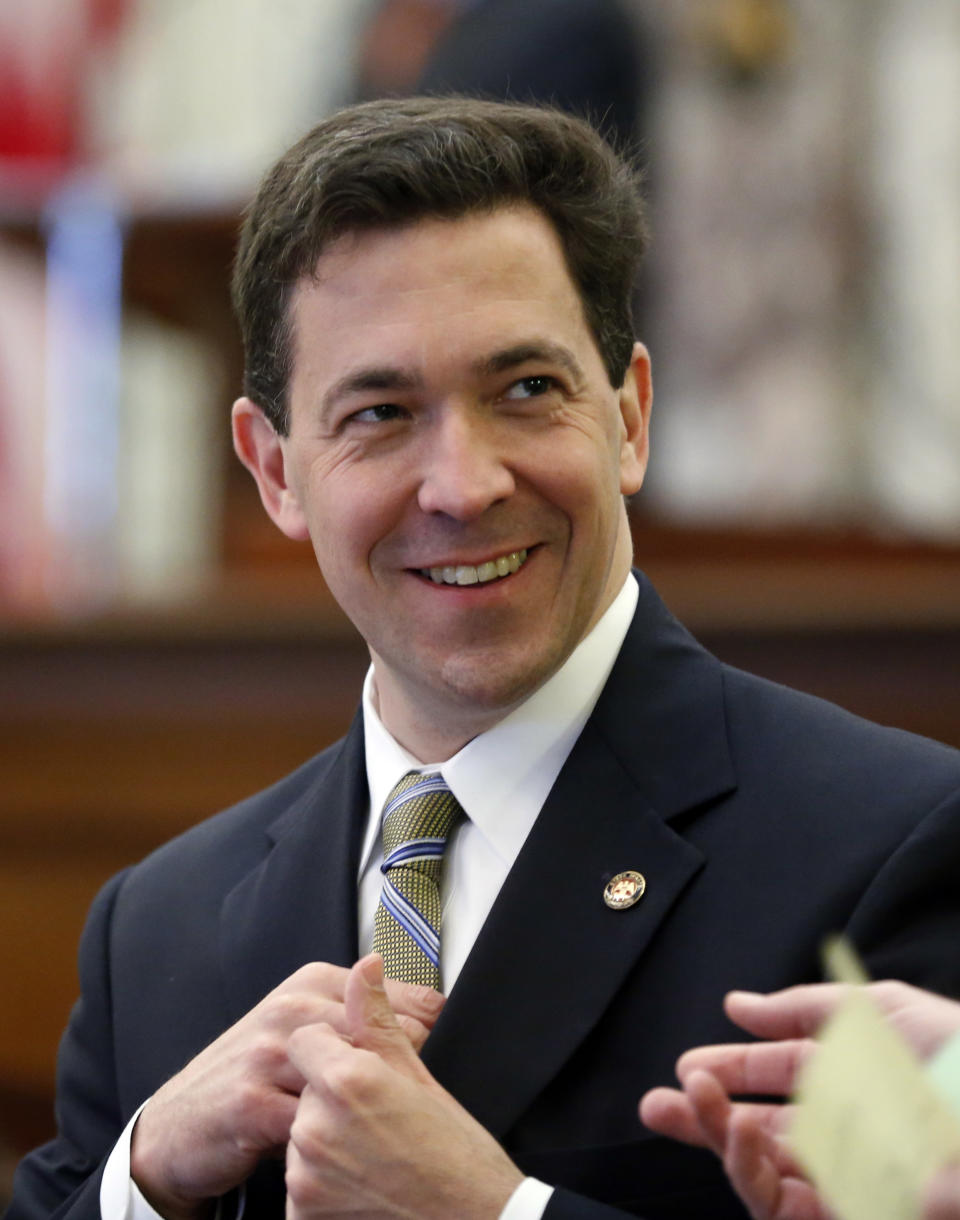 This photo taken Feb. 25, 2014 shows Mississippe State Sen. Chris McDaniel, R-Ellisville,walks around the Senate chambers at the Capitol in Jackson. Thad Cochran is engaged in his toughest campaign in a generation. The former Appropriations Committee chairman faces a June 3 primary challenge from a two-term state lawmaker. Chris McDaniel riles up tea party voters by denouncing big federal spending and portraying the 76-year-old incumbent as a Washington insider who’s lost touch with folks back home. (AP Photo/Rogelio V. Solis)