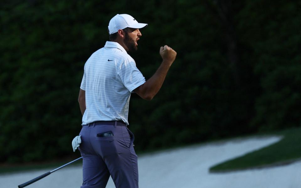 Scottie Scheffler celebrates an eagle on 13