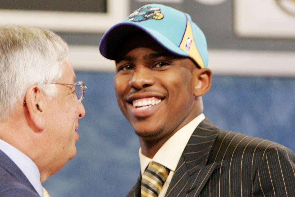 Former commissioner David Stern welcomes Chris Paul to the New Orleans Hornets in the 2005 NBA draft. (AP)