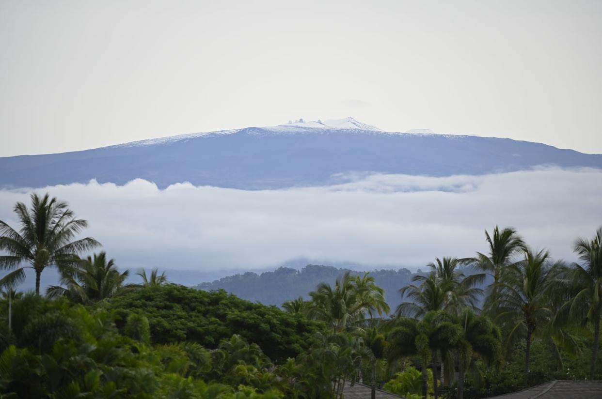Mauna Kea, a dormant volcano in Hawaii, with an observatory visible on its summit. Native Hawaiians consider the mountain sacred and object to construction on it. <a href="https://www.gettyimages.com/detail/news-photo/the-mauna-kea-observatory-is-visible-during-the-first-round-news-photo/1194067651?adppopup=true" rel="nofollow noopener" target="_blank" data-ylk="slk:Chris Condon/PGA TOUR via Getty Images;elm:context_link;itc:0;sec:content-canvas" class="link ">Chris Condon/PGA TOUR via Getty Images</a>