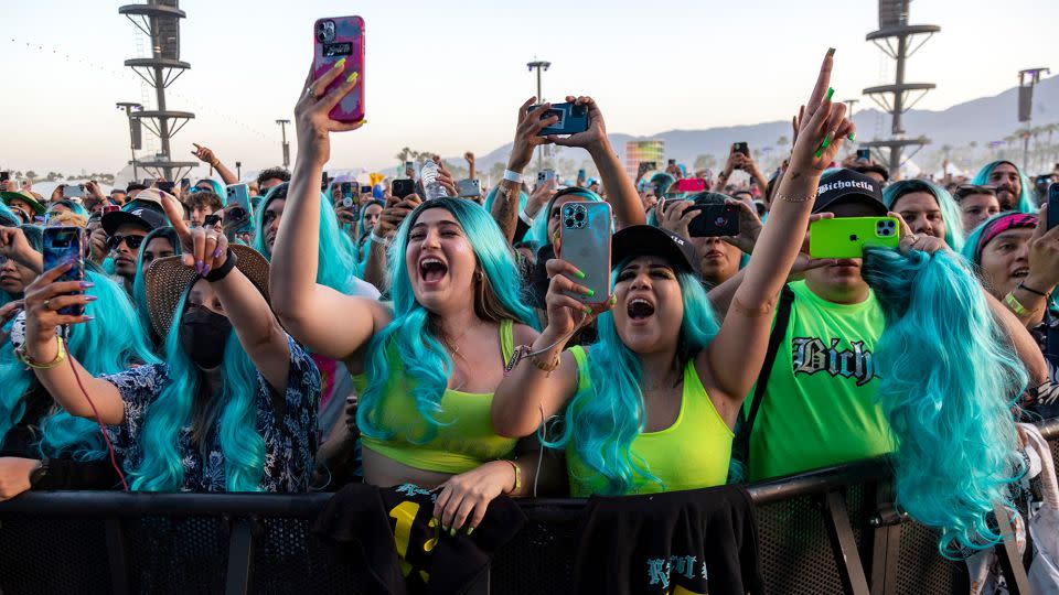 Fans at Karol G's 2022 Coachella performance in California wore blue wigs in the style of her hair at the time. - Gina Ferazzi/Los Angeles Times/Getty Images