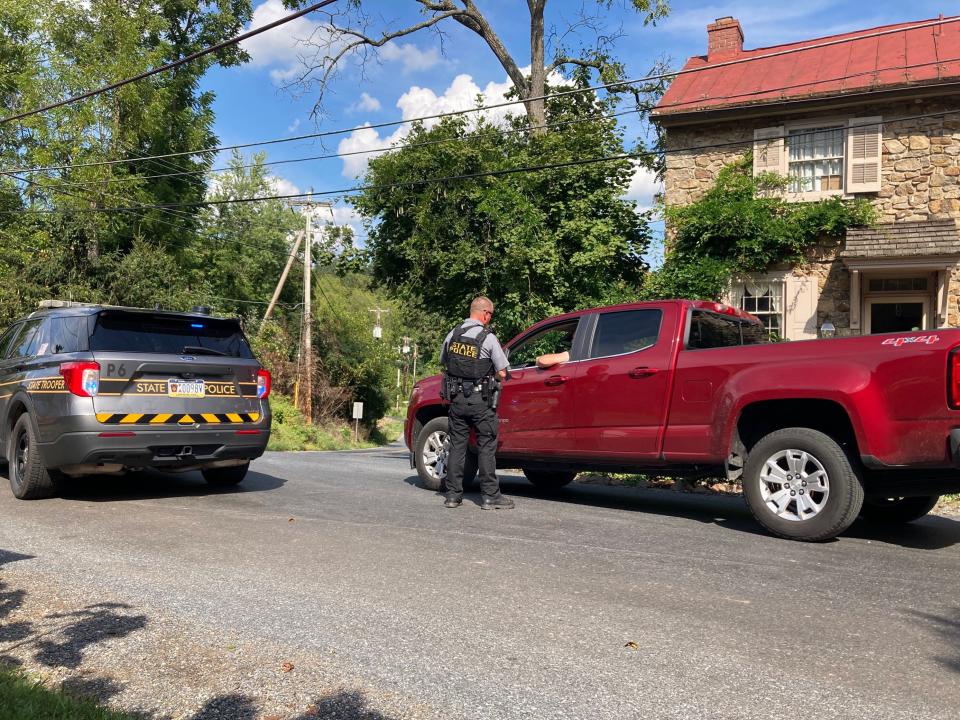 Pennsylvania State Police divert traffic on Fairview Road in East Nantmeal Township as authorities search the densely wooded residential area for escaped killer Danelo Cavalcante on Tuesday, Sept. 12, 2023.