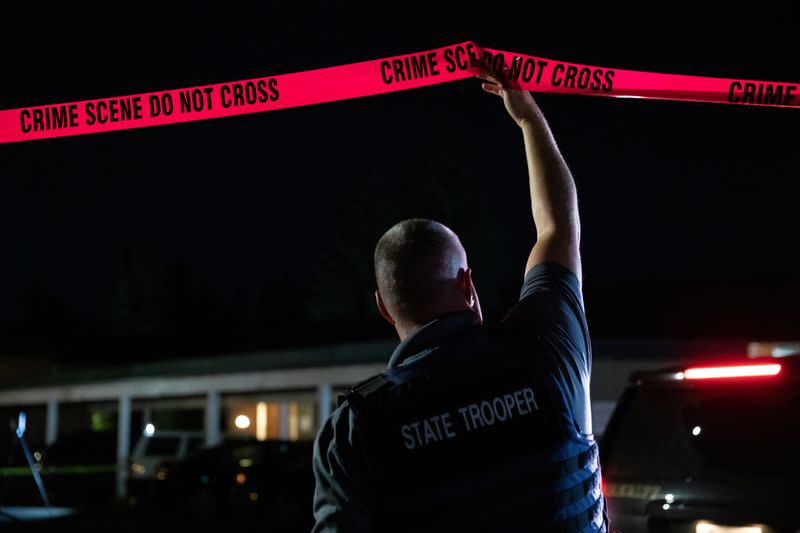 Investigators examine the scene in Lacey, Washington where law enforcement officers reportedly shot and killed Michael Forest Reinoehl