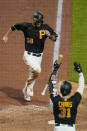 Pittsburgh Pirates' Jacob Stallings (58) scores the second of two runs on a tripe by Hoy Park off Chicago Cubs relief pitcher Adam Morgan during the sixth inning of a baseball game in Pittsburgh, Tuesday, Sept. 28, 2021. (AP Photo/Gene J. Puskar)