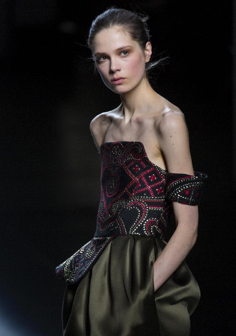 A model walks the runway at the presentation of the Prabal Gurung Fall 2013 fashion collection during Fashion Week, Saturday, Feb. 9, 2013, in New York. (AP Photo/Craig Ruttle)