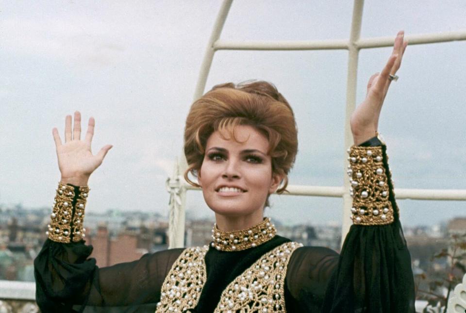 Actress Raquel Welch throws up her hands in dismay