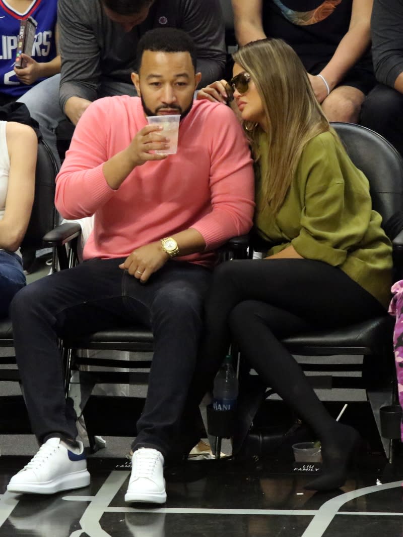 John Legend and Chrissy Teigen at the Lakers game on March 8, 2020. - Credit: Courtesy of Splash