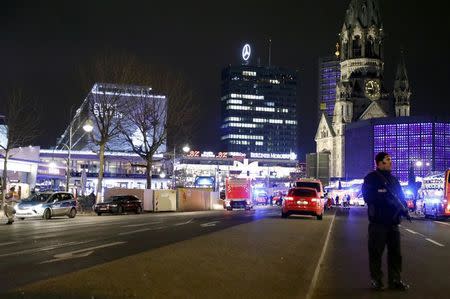 Police stand near the Christmas market in Berlin, Germany December 19, 2016. REUTERS/Pawel Kopczynski