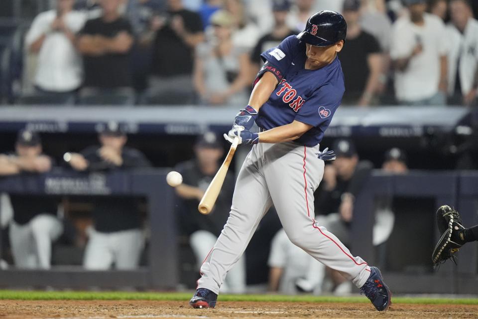 Boston Red Sox's Masataka Yoshida, of Japan, hits a two-run home run during the ninth inning of a baseball game against the New York Yankees, Friday, July 5, 2024, in New York. (AP Photo/Frank Franklin II)