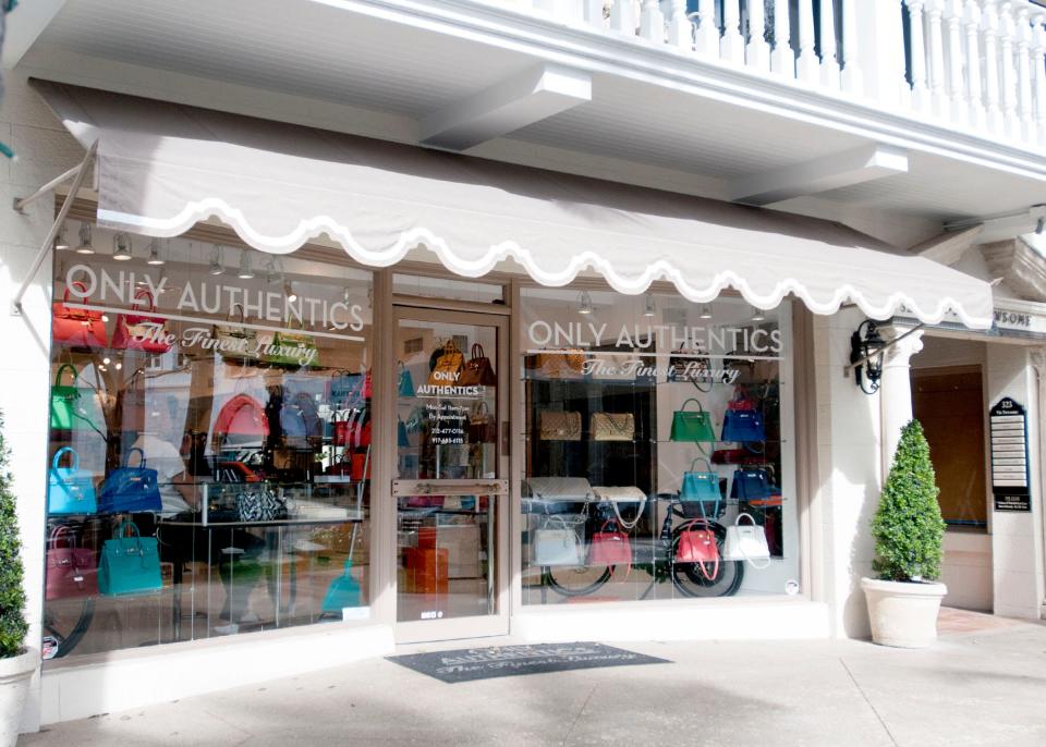 The window of Only Authentics is replaced in Palm Beach, Fla., on December 15, 2021.