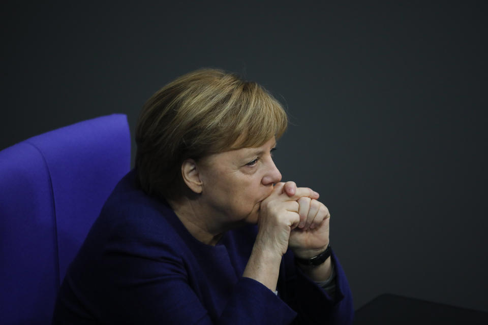 File - In this Tuesday, Dec. 8, 2020 file photo, German Chancellor Angela Merkel attends the debate about Germany's budget 2021, at the parliament Bundestag in Berlin, Germany. German Chancellor Angela Merkel's center-right party, the Christian Democratic Union, CDU, is choosing a new leader on the weekend Saturday Jan. 16 and Sunday Jan. 17, 2021, a decision that will help determine who succeeds Merkel at the helm of the European Union's biggest economy after a 16-year reign. Merkel, now 66, has steered Germany, and Europe, through a series of crises since she took office in 2005, she said over two years ago that she won't seek a fifth term as chancellor. (AP Photo/Markus Schreiber, file)