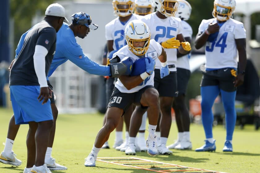 COSTA MESA, CA - JULY 28: Chargers running back Austin Ekeler (30) goes through drills at LA Chargers training camp at Jack R. Hammett Sports Complex on Thursday, July 28, 2022 in Costa Mesa, CA. (Gary Coronado / Los Angeles Times)